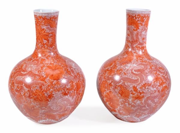 A pair of Chinese bottle vases, decorated in iron