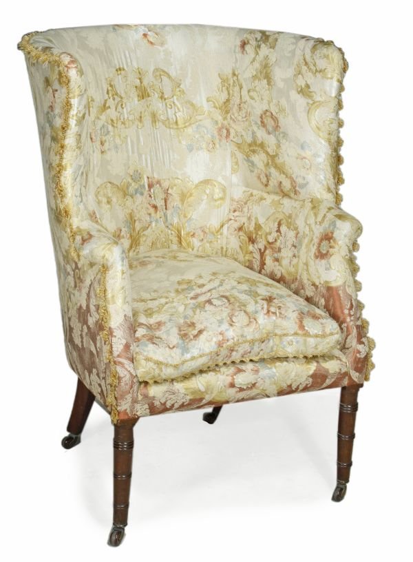 A Regency mahogany and upholstered wing armchair,