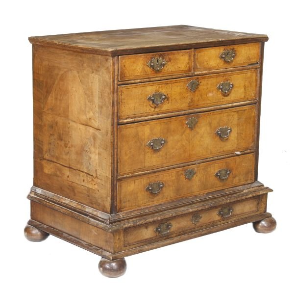 A walnut chest of drawers, circa 1720 and later,