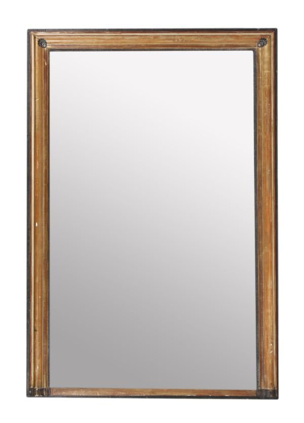 A parcel gilt, cream painted and ebonised wall mir
