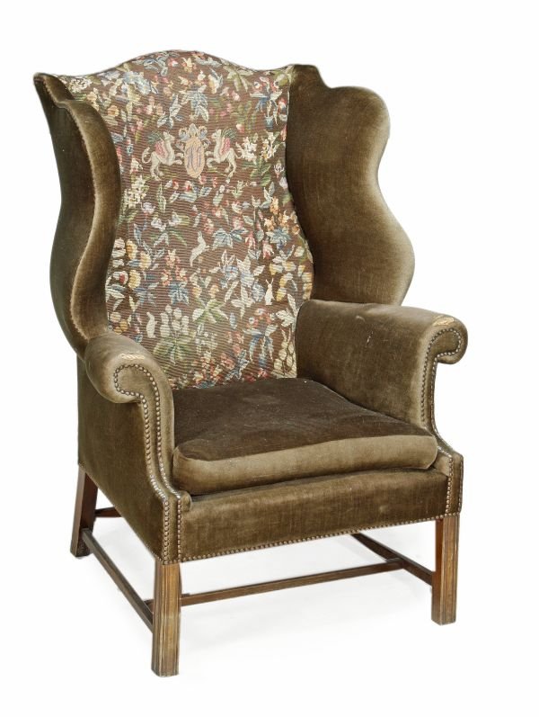 A beech framed and upholstered wing chair , 20th c