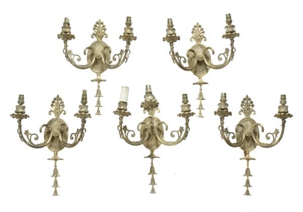 A set of five gilt metal wall appliques, in George