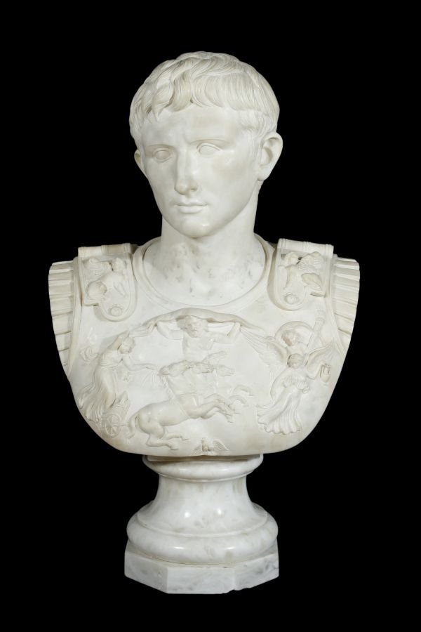 A white marble bust of Caesar Augustus, on a wais