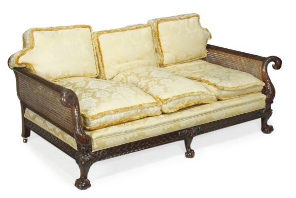 A carved mahogany three piece bergere suite, in Ge