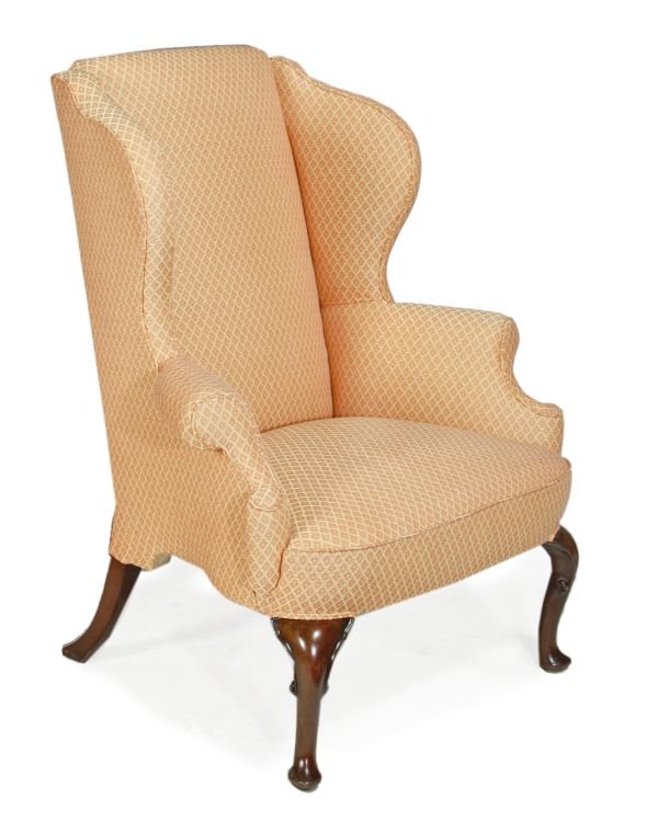 A George II mahogany framed and upholstered wing a