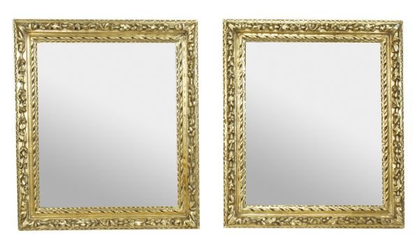 A pair of carved giltwood framed wall mirrors, 19