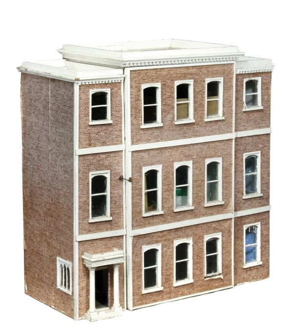 A white painted and paper decorated dolls house,