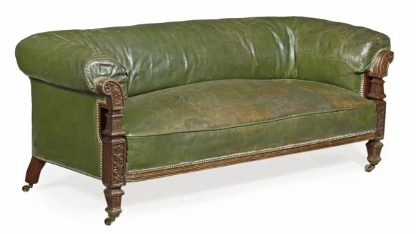 A Victorian walnut and studded green leather uphol