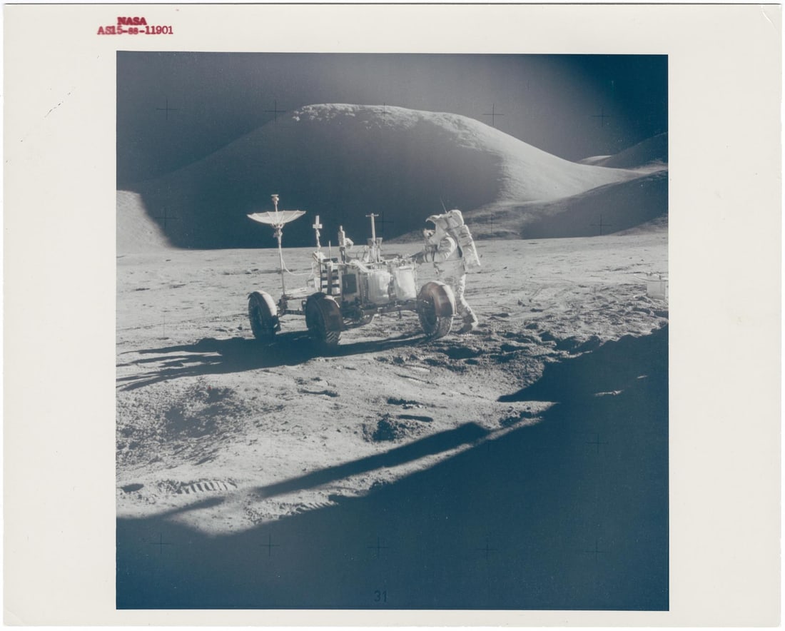[Apollo 15] PORTRAIT OF JAMES IRWIN AND THE LUNAR ROVER IN FRONT OF MOUNT HADLEY: [Apollo 15] PORTRAIT OF JAMES IRWIN AND THE LUNAR ROVER IN FRONT OF MOUNT HADLEYDavid Scott, 26 July - 7 August 1971, EVA 1Printed 1971.Vintage gelatin silver print on fibre-based paper.With NASA capt