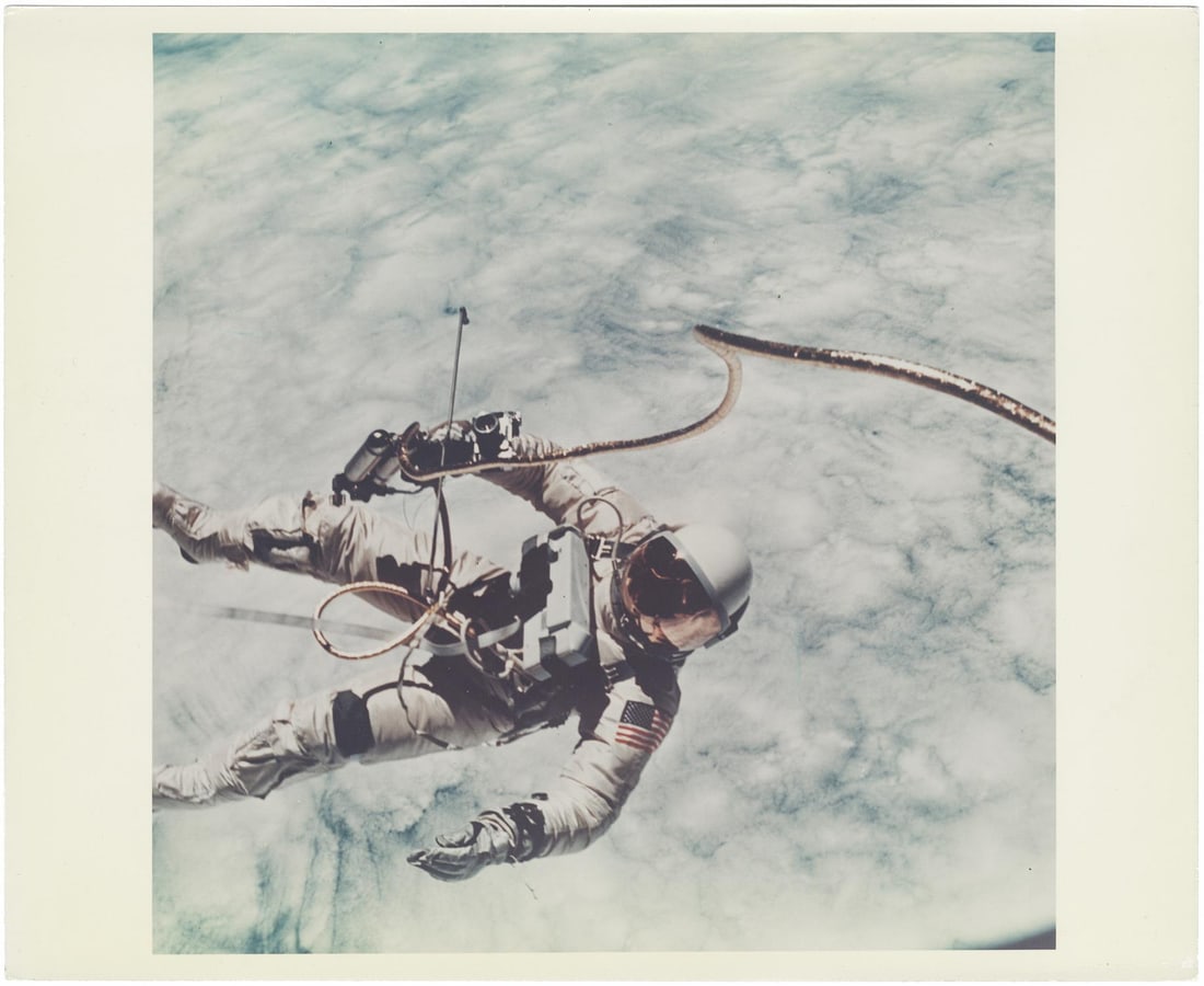 [Gemini IV] FIRST U.S. SPACEWALK: ED WHITE FLOATING OVER CLOUDS ABOVE SOUTHERN CALIFORNIA (1 of 4)