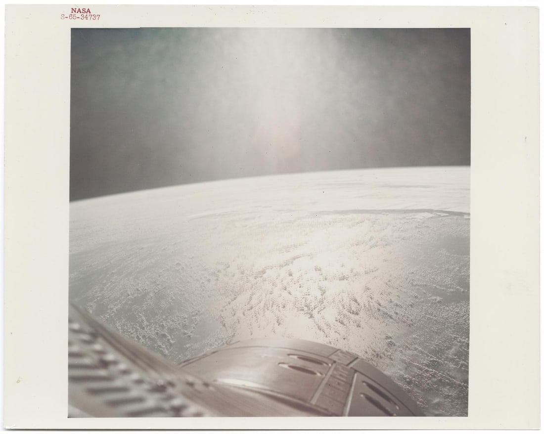 [Gemini IV] SPACE SUNRISE: [Gemini IV] SPACE SUNRISE Ed White or James McDivitt, 3-7 June 1965Printed 1965.Vintage chromogenic print on fibre-based Kodak paper.With A Kodak Paper watermark on the verso, numbered NASA S-65-34737
