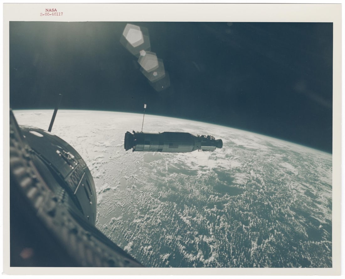 [Gemini X] COVER OF LIFE: SUN-ILLUMINATED AGENA SET AGAINST THE CURVATURE OF EARTH (1 of 4)