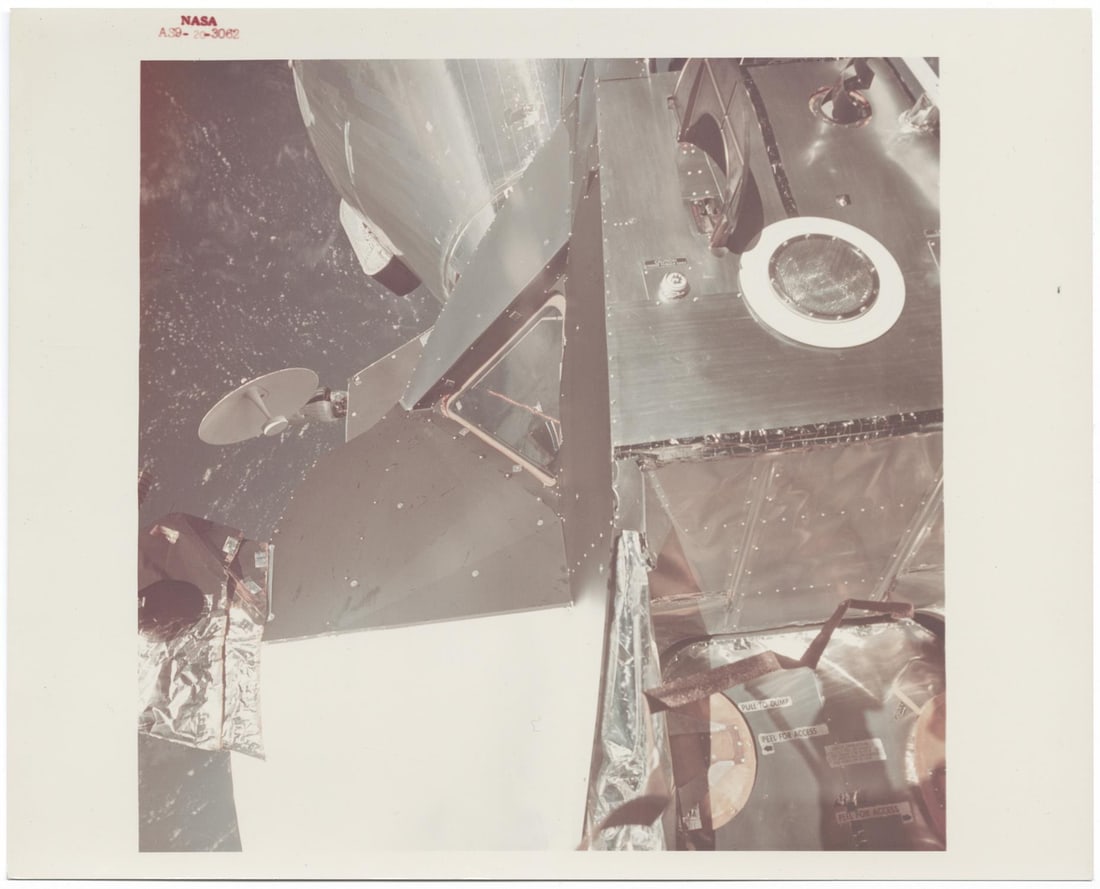 [Apollo 9] FIRST APOLLO EVA: OUTER-SPACE VIEW OF THE DOCKED SPACECRAFT (1 of 2)