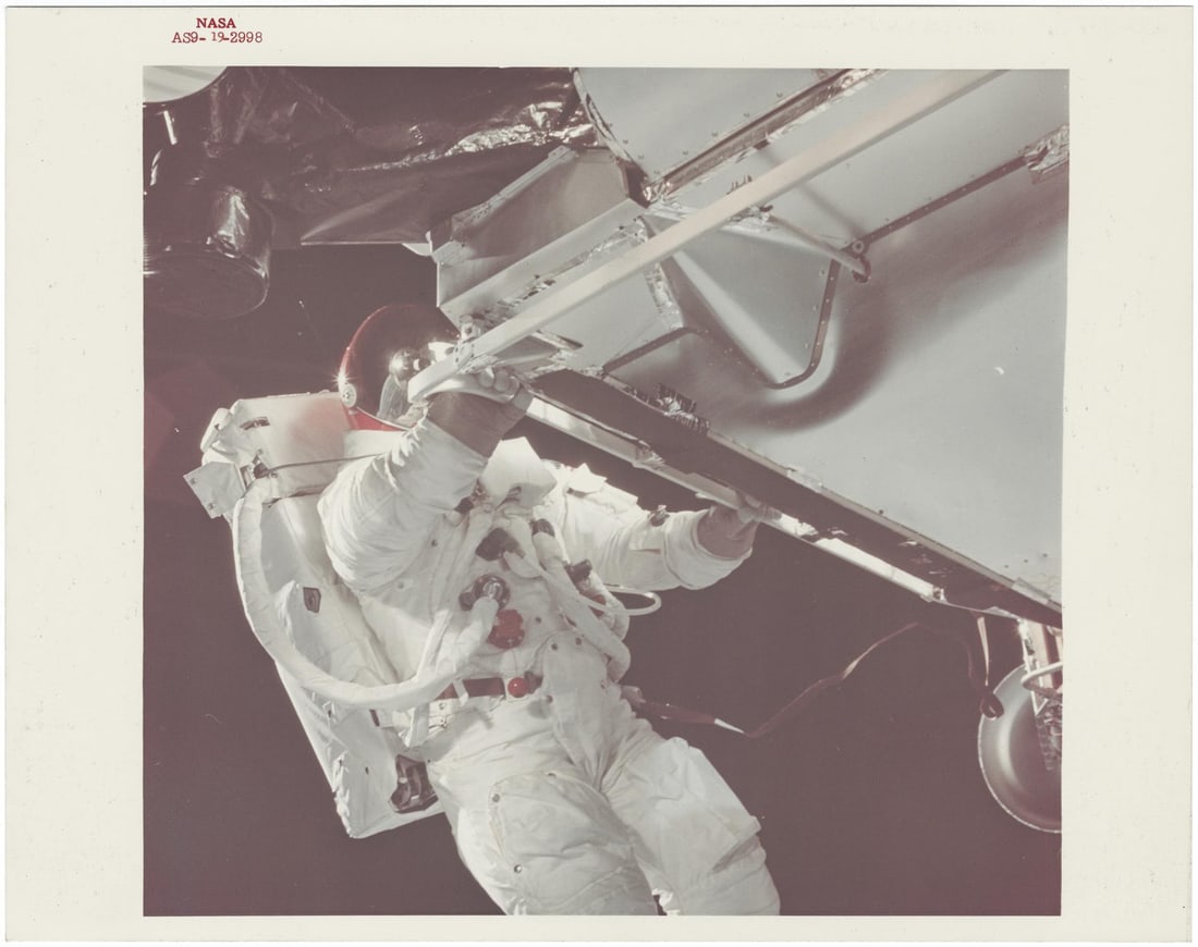 [Apollo 9] FIRST APOLLO EVA: RUSSELL SCHWEICKART FLOATING FREELY OUTSIDE LM SPIDER (1 of 2)
