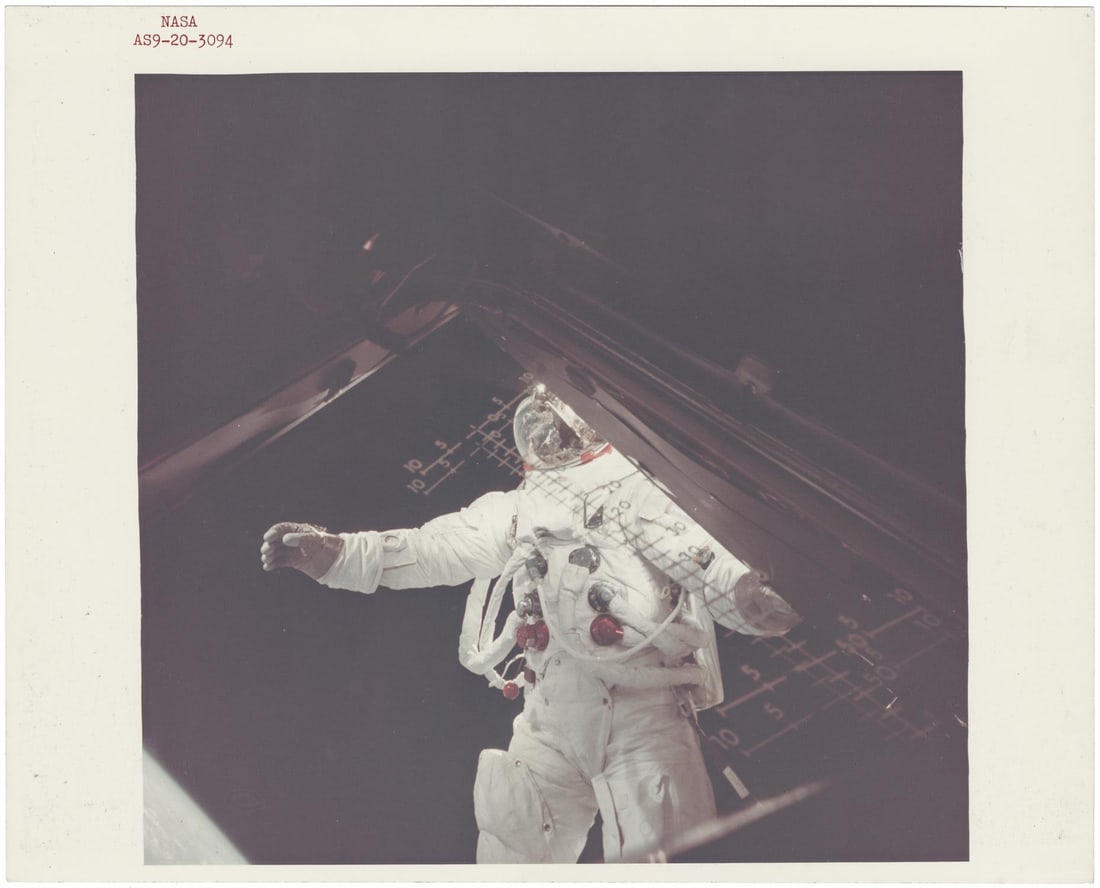 [Apollo 9] FIRST APOLLO EVA: SCHWEICKART SUSPENDED IN SPACE, TAKING IN THE VIEW OF EARTH (1 of 2)