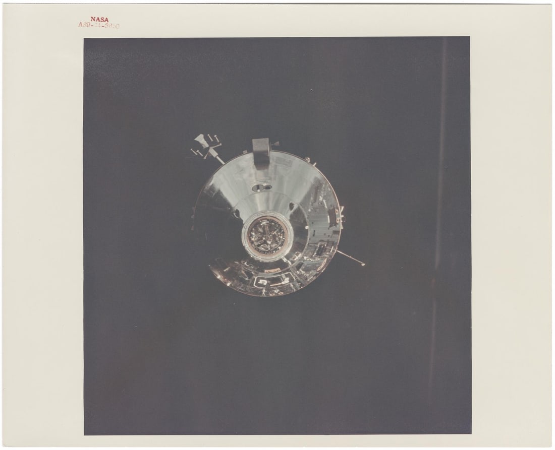 [Apollo 9] COMMAND MODULE GUMDROP SET AGAINST THE DARK SKY OF SPACE (1 of 2)