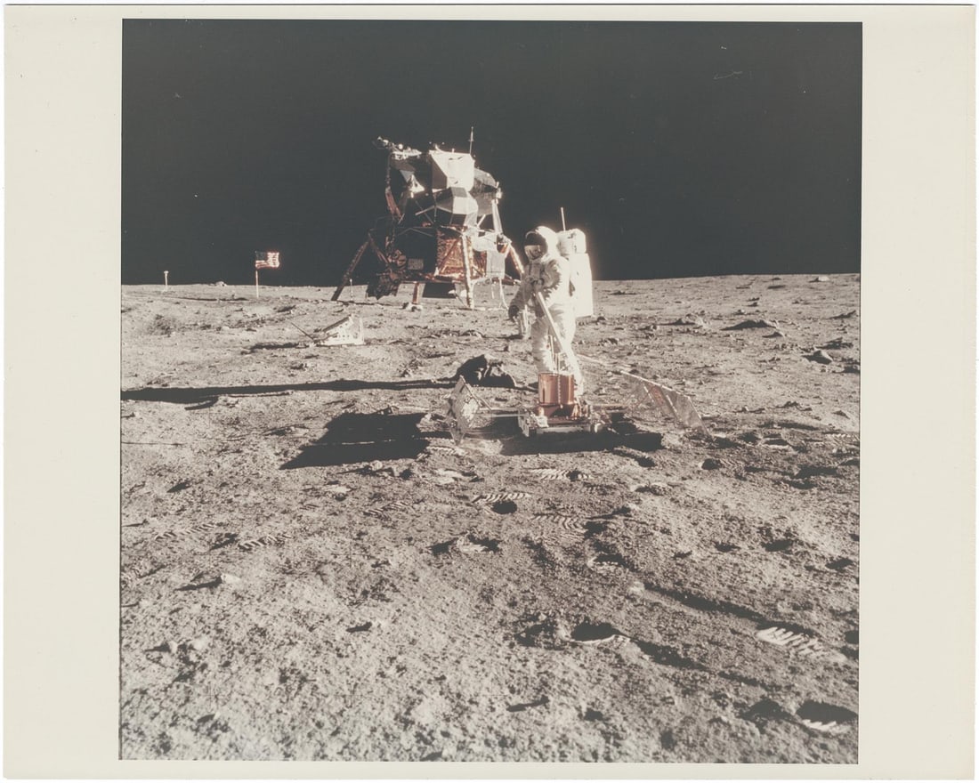 [Apollo 11] BUZZ ALDRIN AT TRANQUILITY BASE WITH THE LM EAGLE, U.S. FLAG, AND EXPERIMENTS (1 of 3)