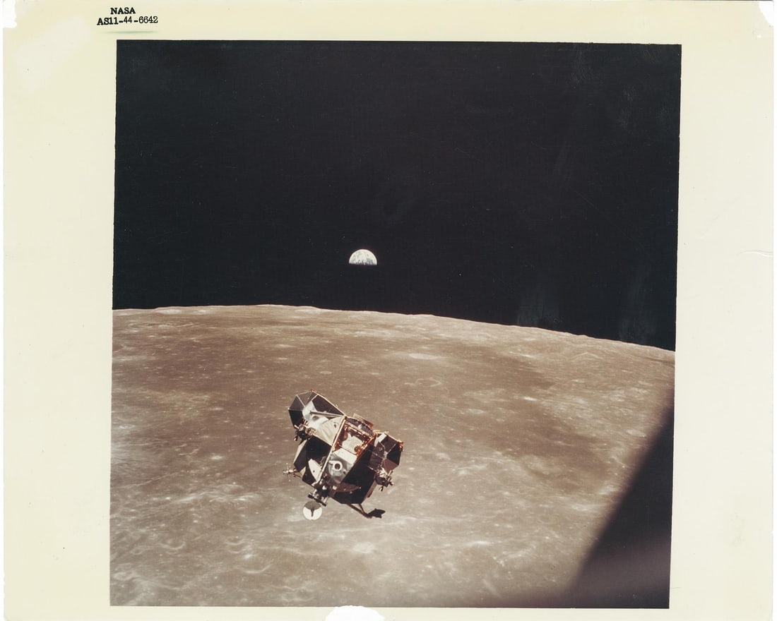 [Apollo 11] THE LUNAR MODULE EAGLE FRAMED BY A MAJESTIC EARTHRISE (1 of 4)