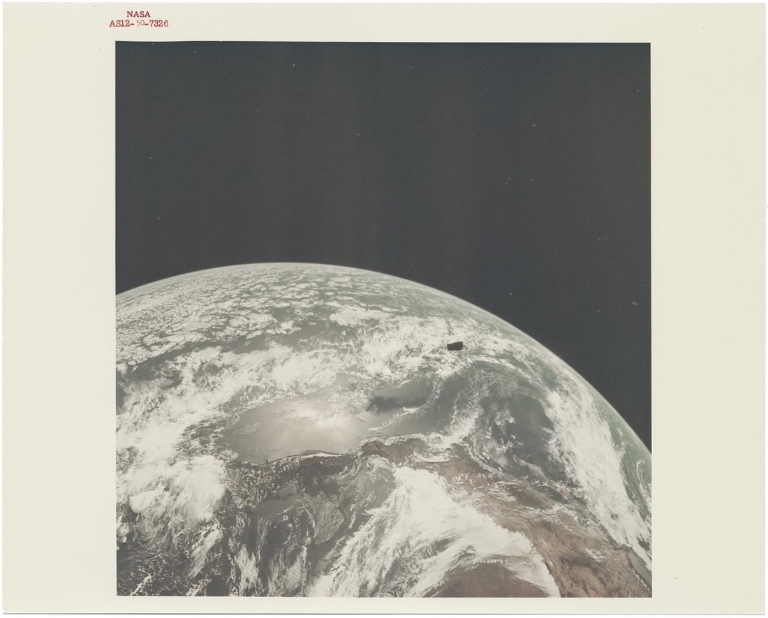 [Apollo 12] SUN-ILLUMINATED EARTH AFTER TRANSLUNAR INJECTION (1 of 2)