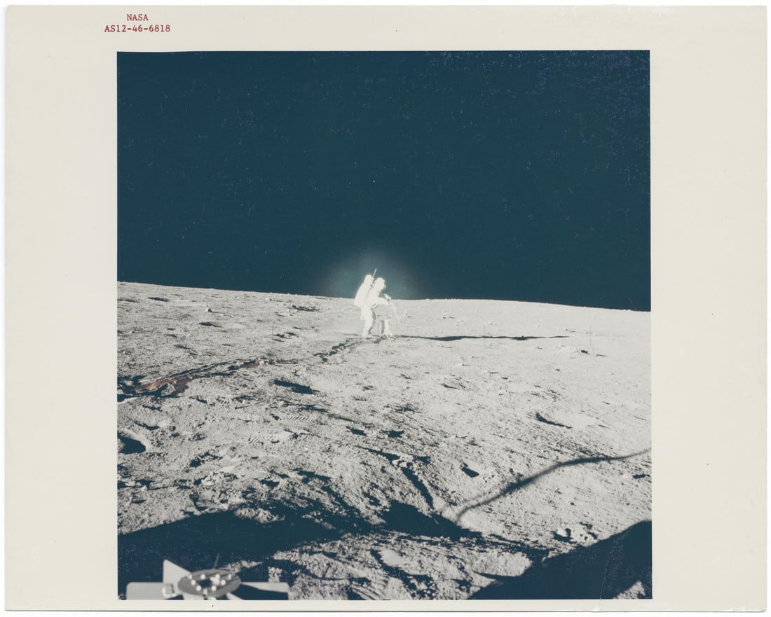 [Apollo 12] BLUE HALO AROUND ALAN BEAN DEPLOYING SCIENCE EXPERIMENTS AT THE OCEAN OF STORMS (1 of 3)