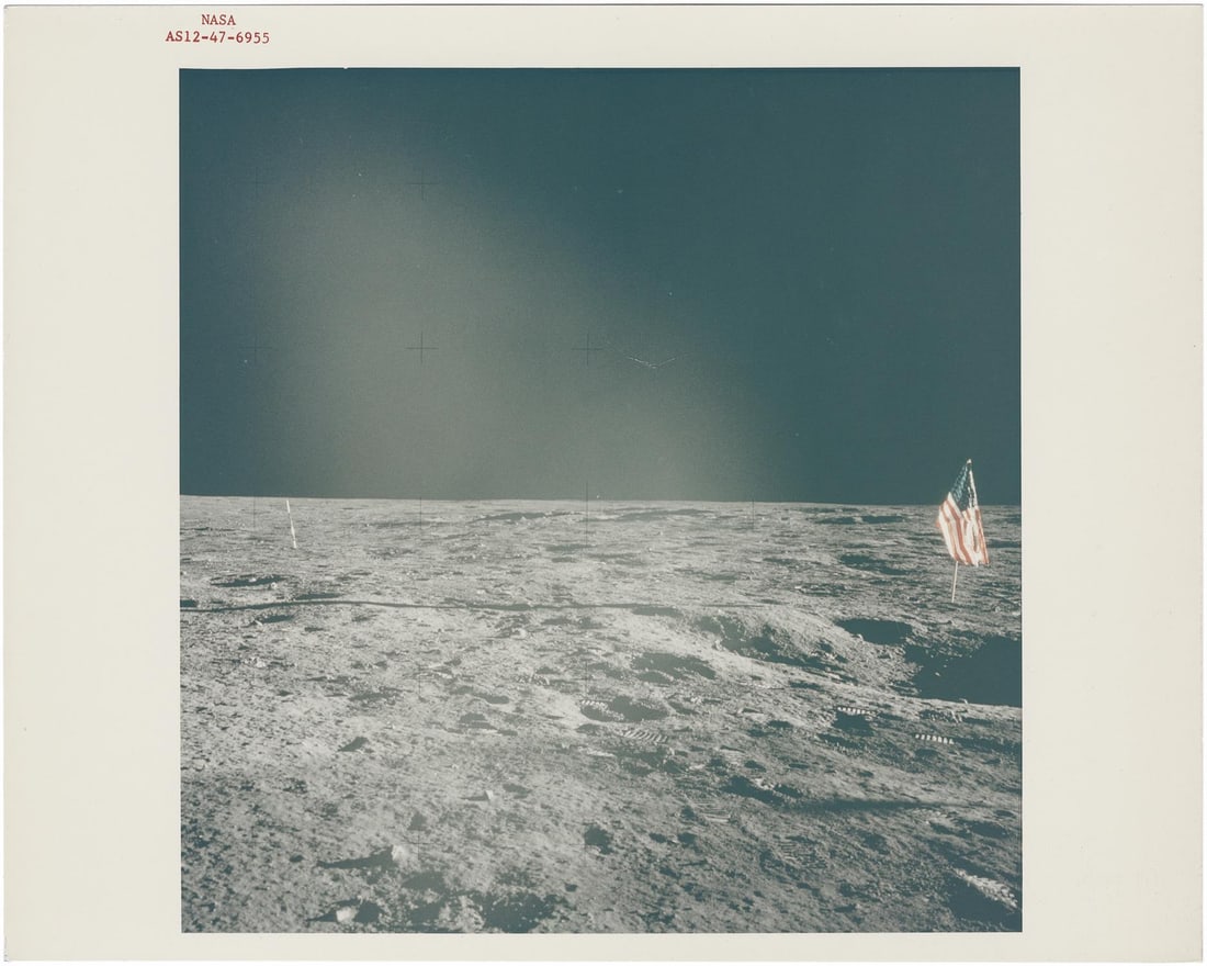 [Apollo 12] THE AMERICAN FLAG AT OCEAN OF STORMS BASE (1 of 2)