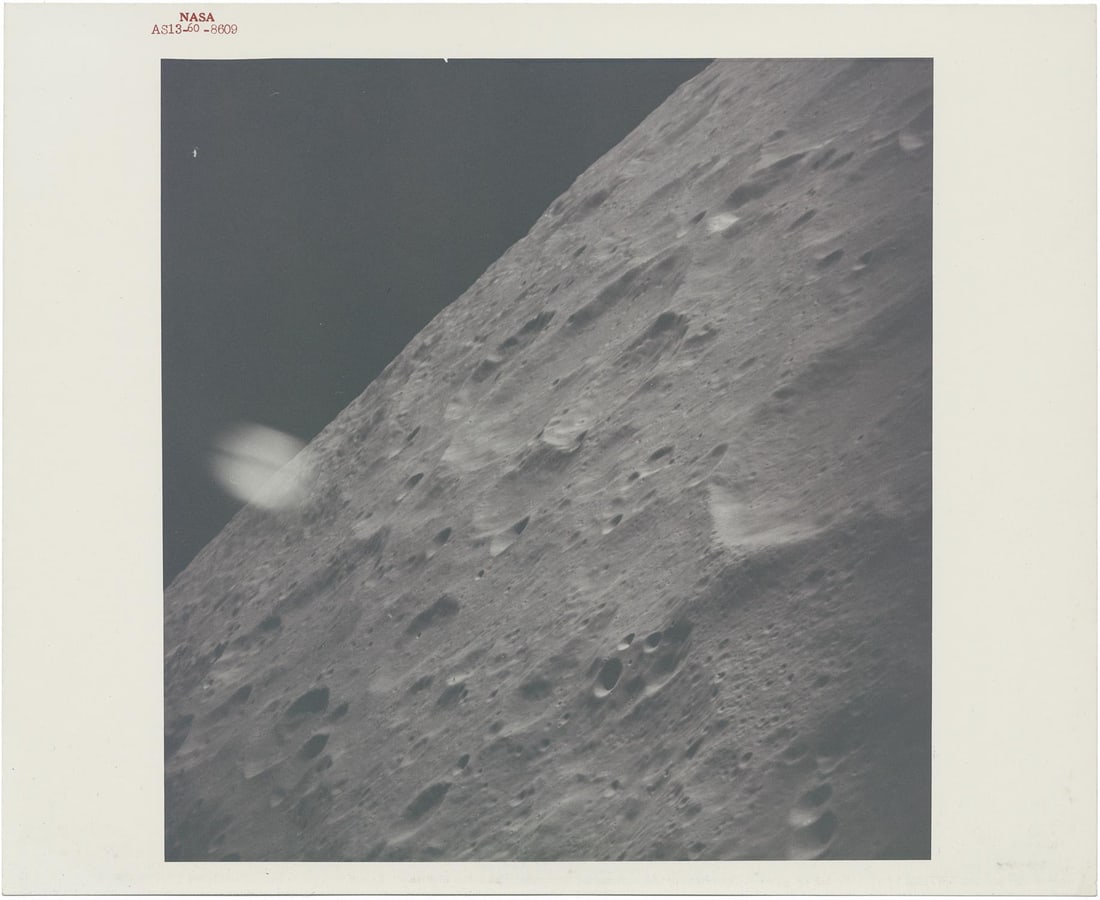 [Apollo 13] A GLIMPSE OF LUNAR SURFACE AS THE CRIPPLED SPACECRAFT SLINGSHOTS AROUND THE MOON (1 of 2)