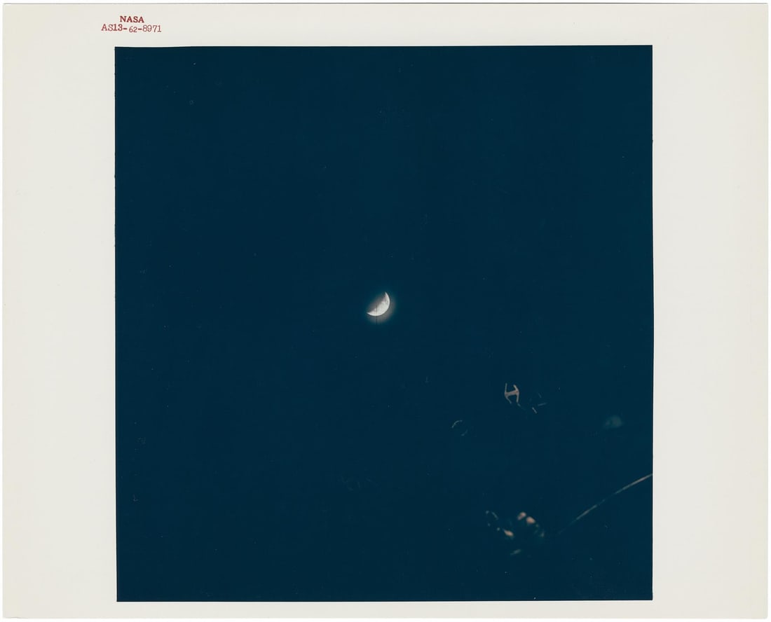 [Apollo 13] THE GLOWING EARTH ABOVE THE STRICKEN SPACECRAFT DURING APOLLO 13’S JOURNEY HOME (1 of 2)