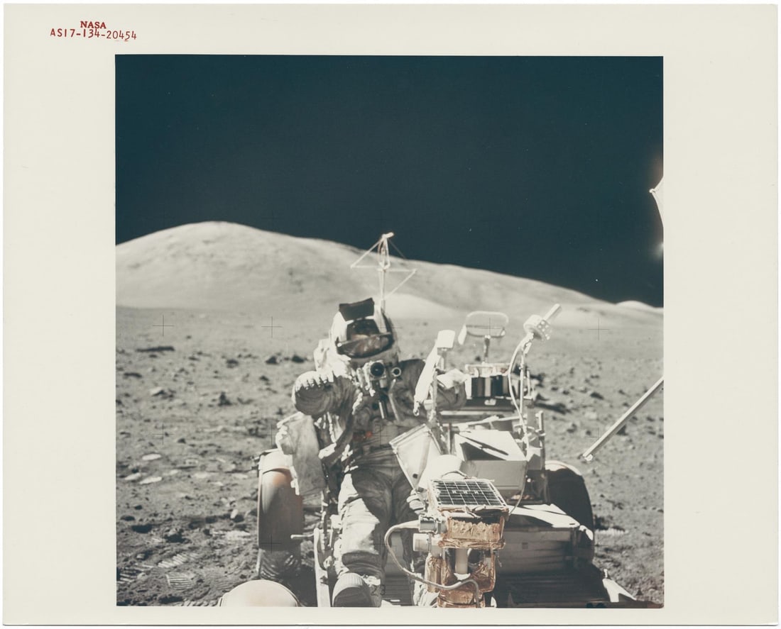 [Apollo 17] HARRISON SCHMITT MOUNTING THE ROVER FOR ONE LAST RIDE ACROSS THE MOON (1 of 3)