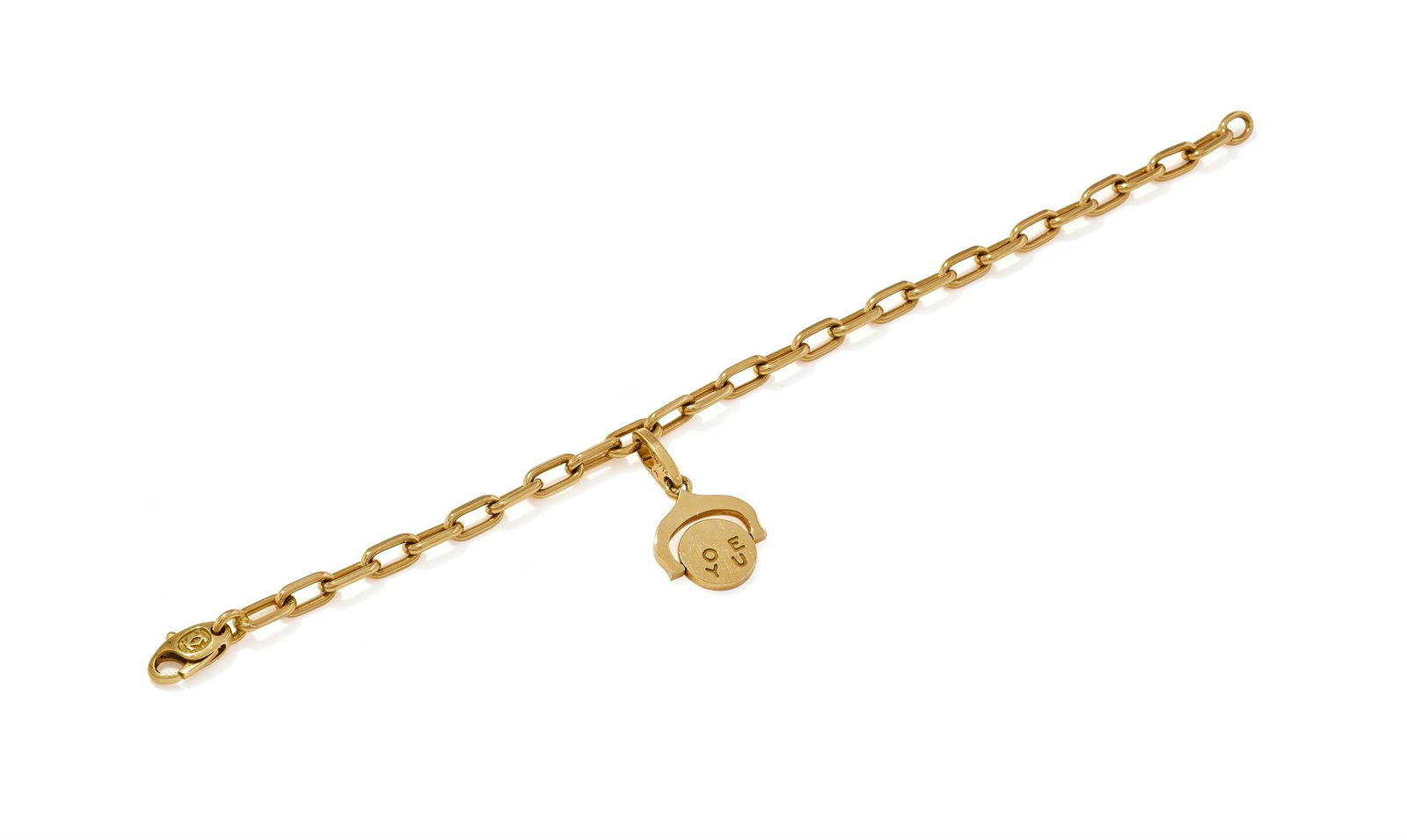 CARTIER, A 'SANTOS' BRACELET WITH 'I LOVE YOU' CHARM: CARTIER, A 'SANTOS' BRACELET WITH 'I LOVE YOU' CHARMThe 18ct gold filed link bracelet, suspending a 18ct gold detachable charm with a swivel disc engraved I Love You, each signed Cartier, maker's