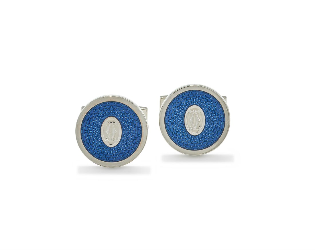 CARTIER, A PAIR OF SILVER AND ENAMEL 'DOUBLE C DE CARTIER' CUFFLINKS: CARTIER, A PAIR OF SILVER AND ENAMEL 'DOUBLE C DE CARTIER' CUFFLINKS Each circular disc with double C logo to centre, within a blue guilloché enamel surround, to T-bar terminals, signed Cartier,