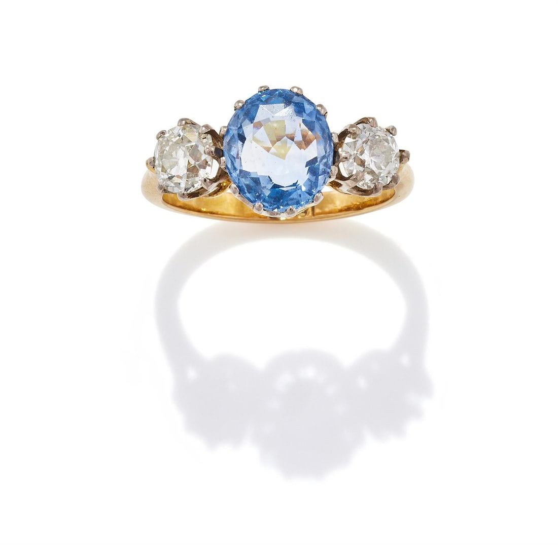 A SAPPHIRE AND DIAMOND THREE STONE RING (1 of 3)