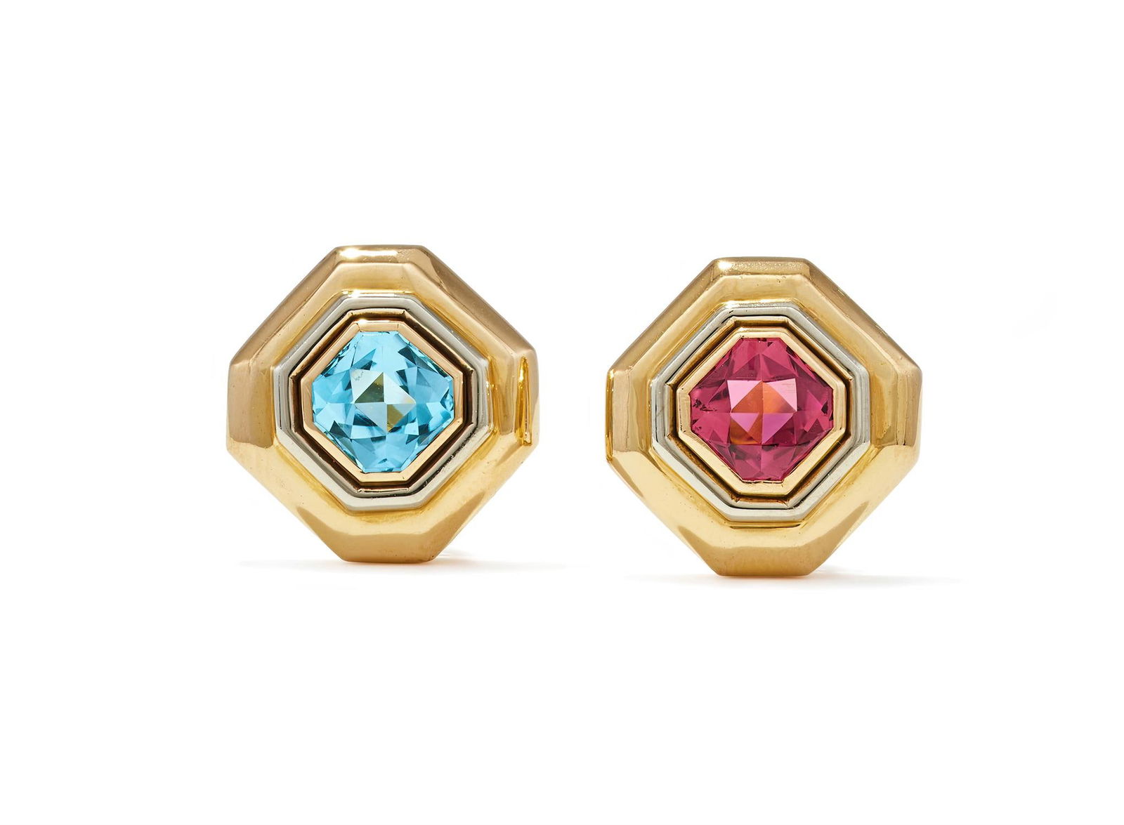 TIFFANY & CO., A PAIR OF PINK TOURMALINE AND BLUE TOPAZ EARRINGS: TIFFANY & CO., A PAIR OF PINK TOURMALINE AND BLUE TOPAZ EARRINGSCIRCA 1989The polished octagonal bi-colour 18ct gold earrings set with either an octagonal buff top pink tourmaline or blue topaz, with