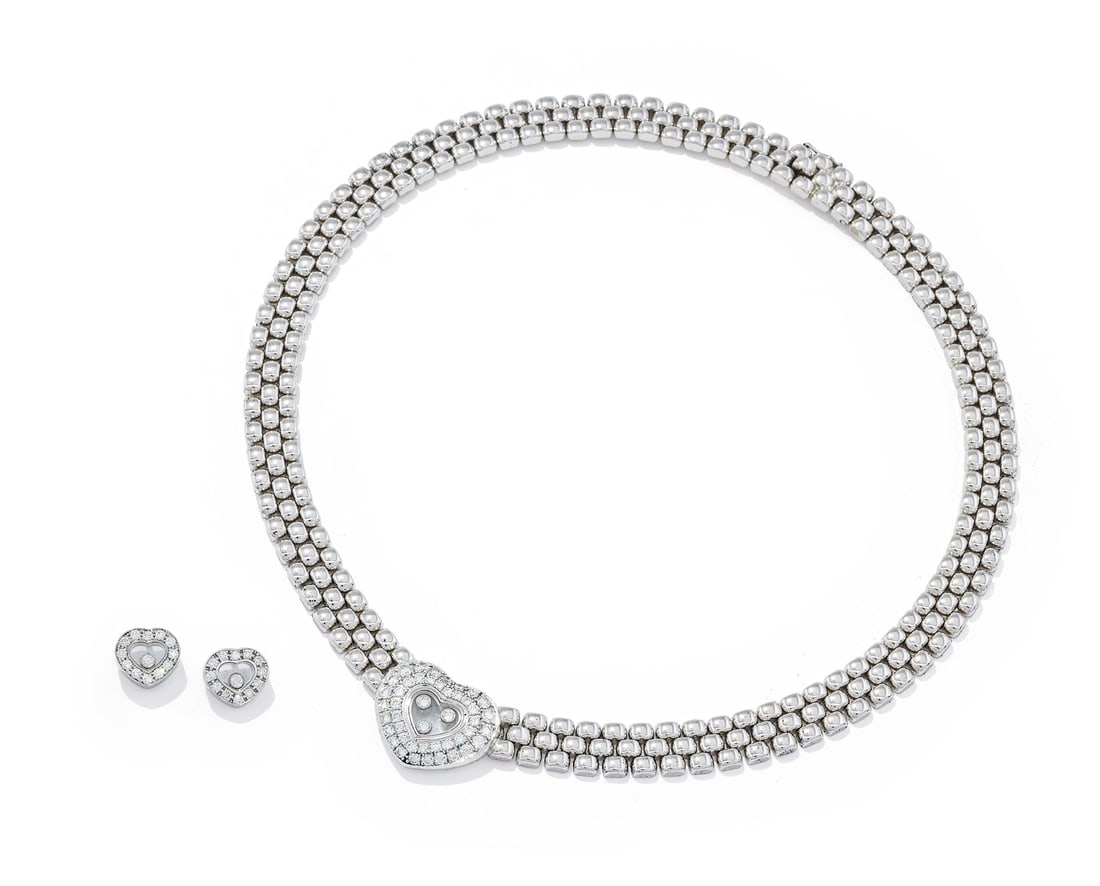 CHOPARD, A 'HAPPY DIAMONDS' NECKLACE AND EARRINGS: CHOPARD, A 'HAPPY DIAMONDS' NECKLACE AND EARRINGSThe brilliant cut diamond pavé set heart-shaped centre with five free moving brilliant-cut diamond collets in the central glazed compartment, to a