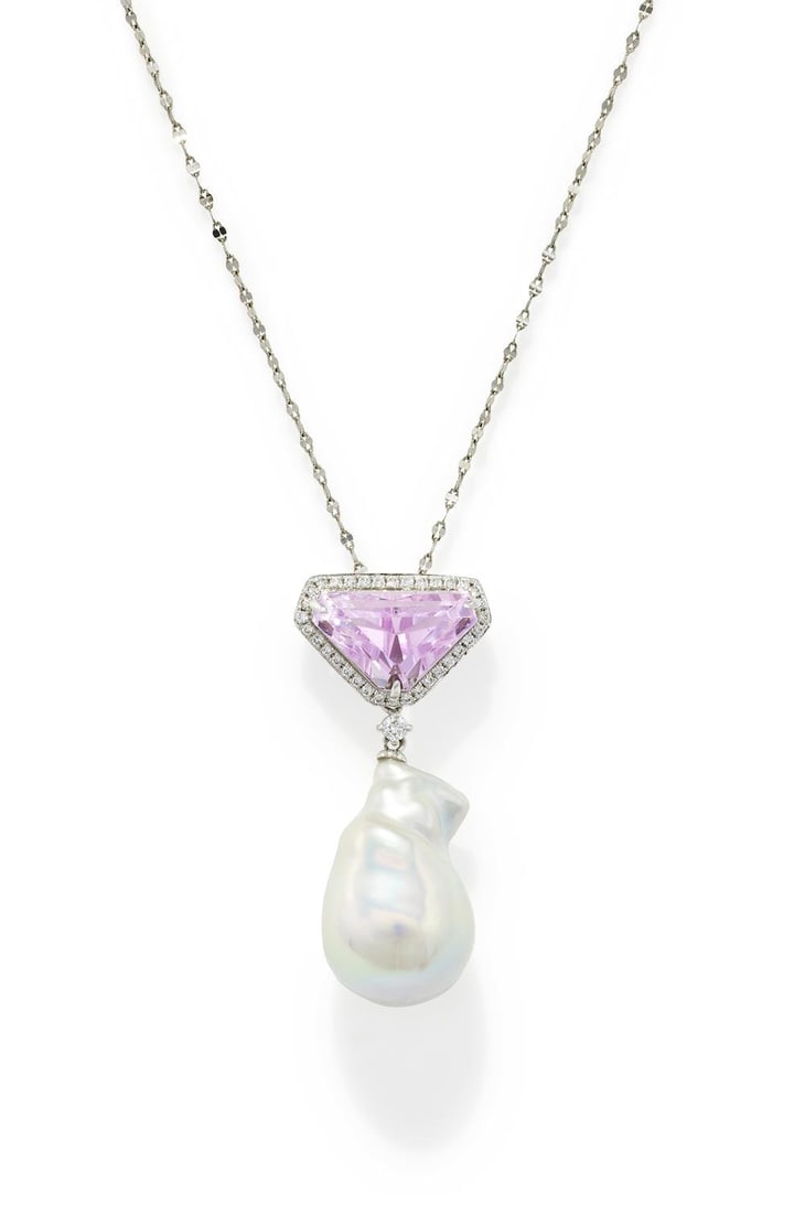 A KUNZITE, DIAMOND AND CULTURED FRESHWATER PEARL PENDANT: A KUNZITE, DIAMOND AND CULTURED FRESHWATER PEARL PENDANT The triangular kunzite within a brilliant cut diamond surround, to a brilliant cut diamond spacer suspending a baroque freshwater cultured