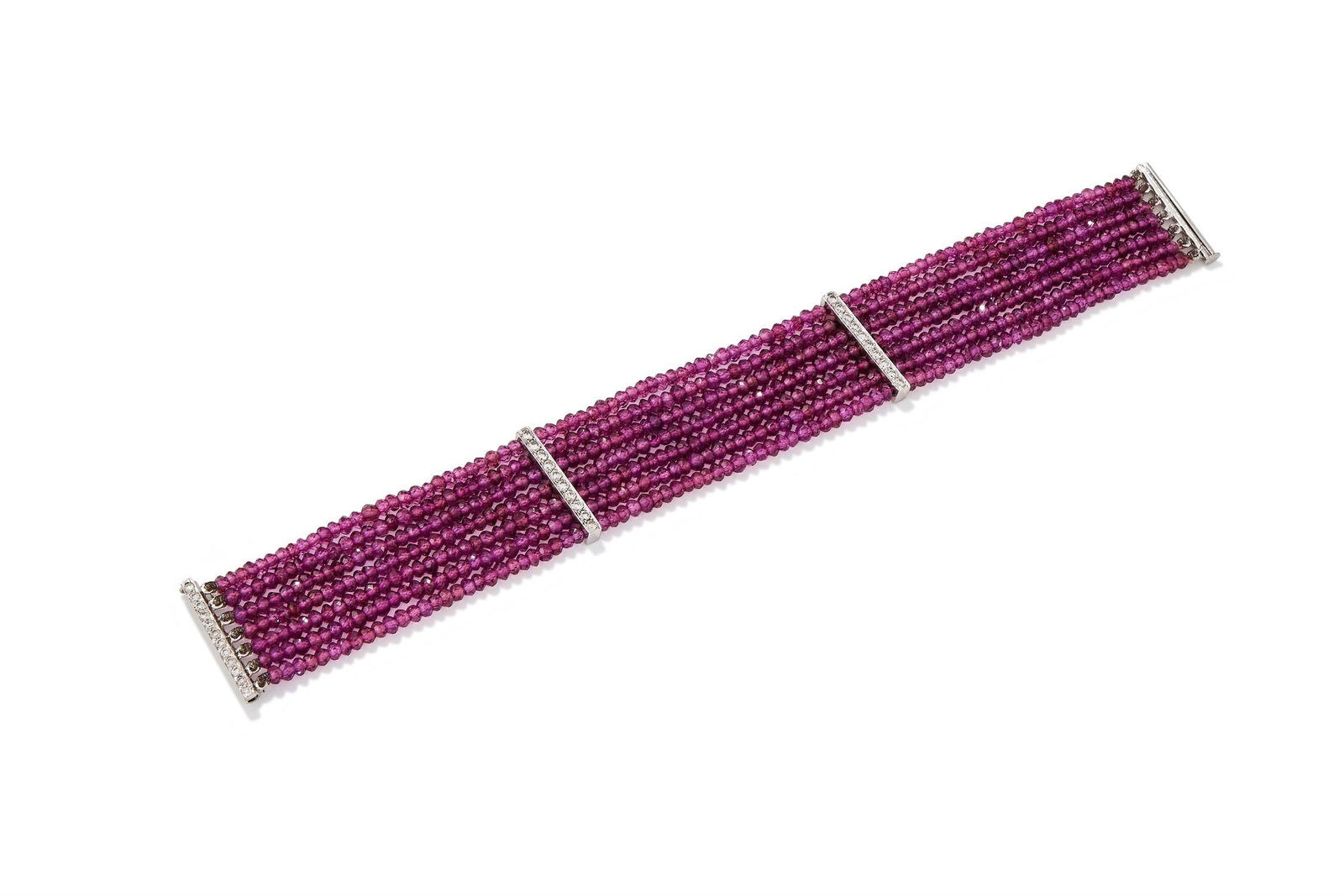 A DIAMOND AND GARNET BEAD BRACELET: A DIAMOND AND GARNET BEAD BRACELET Composed of seven strands of faceted garnet beads, to brilliant cut diamond bar spacers and clasp, unmarkedSize/dimensions: 17.4cm longGross weight: 24.1 grams
