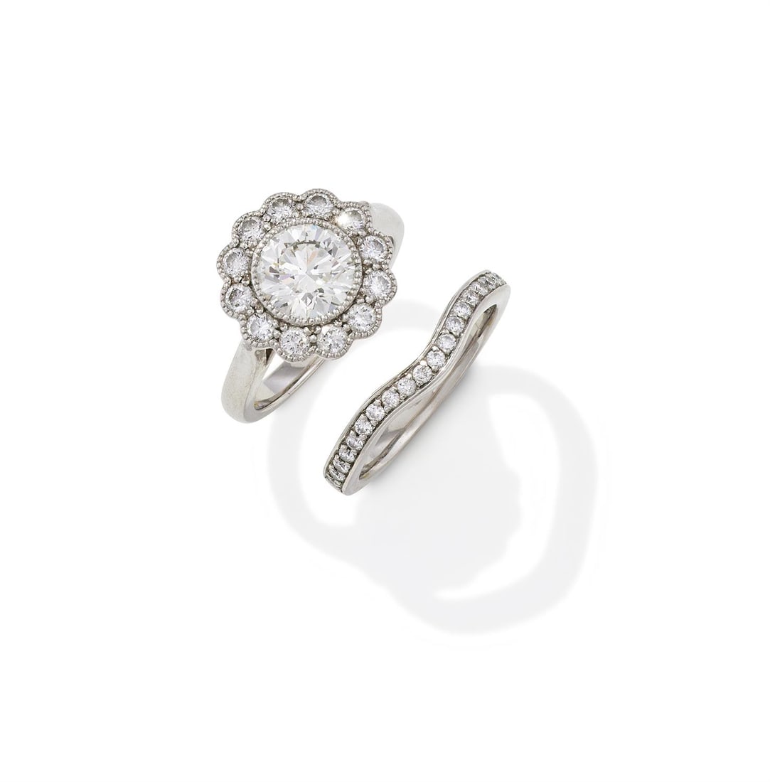 A DIAMOND CLUSTER RING AND BAND RING (1 of 3)