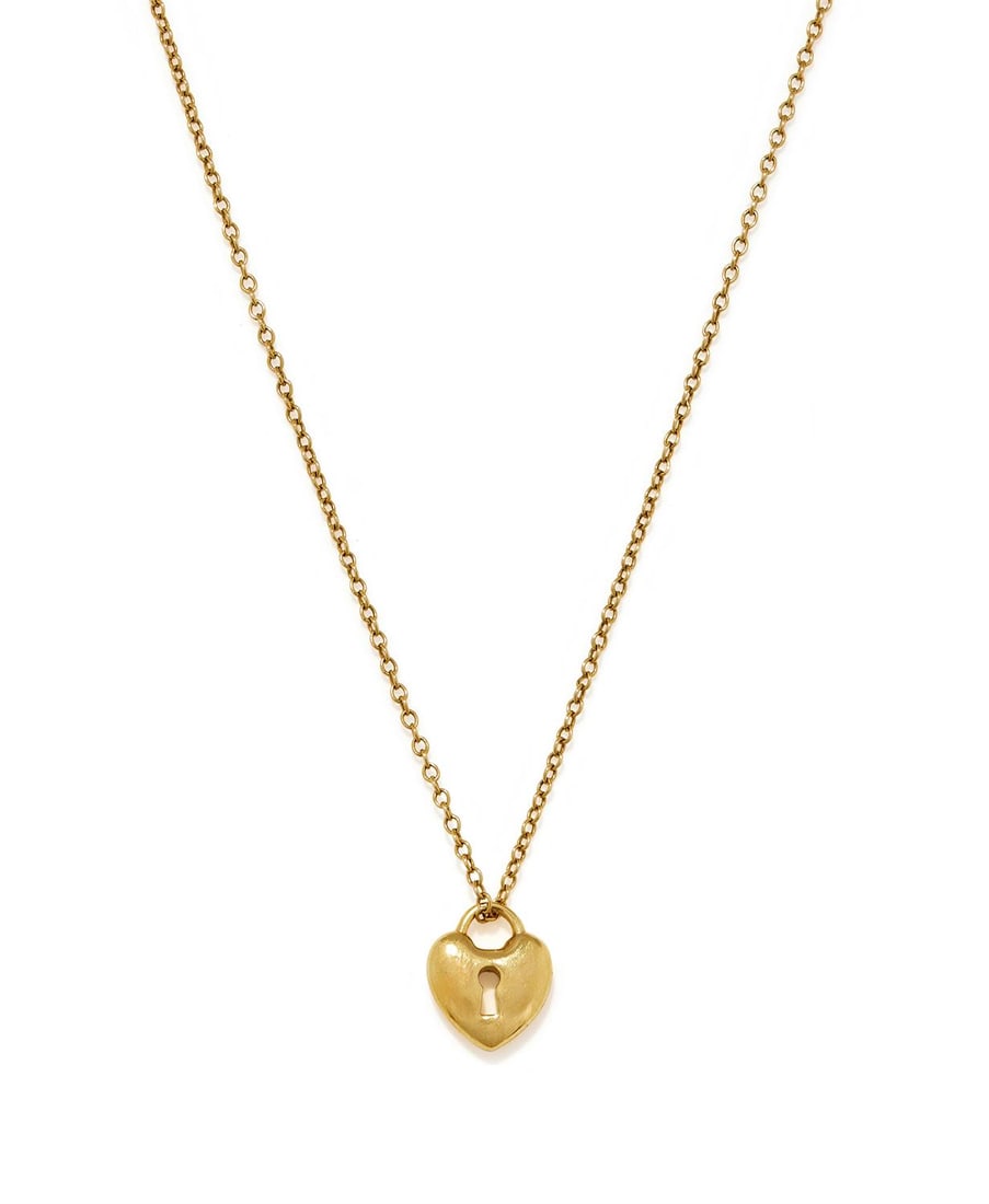 TIFFANY & CO., A HEART PADLOCK PENDANT: TIFFANY & CO., A HEART PADLOCK PENDANTThe heart shaped padlock with keyhole, suspended from an associated long trace link chain, pendant signed T&Co., 750, chain stamped 14KSize/dimensions: pendant 1.