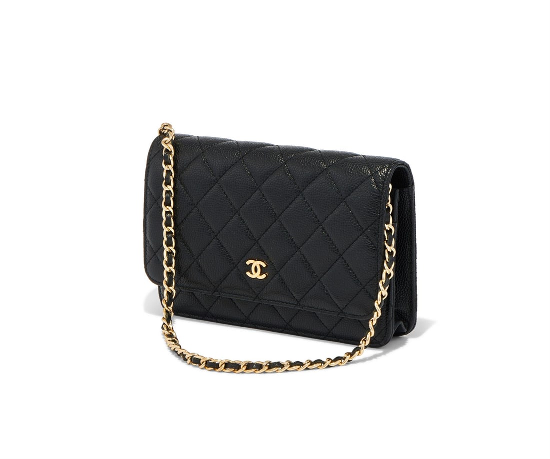 CHANEL, WALLET ON CHAIN, A BLACK CAVIAR LEATHER HANDBAG: CHANEL, WALLET ON CHAIN A BLACK CAVIAR LEATHER HANDBAG, NO. 10218184 The black leather exterior with small slip pocket, to burgundy fabric and leather interior with slipper card pockets, an open pocke