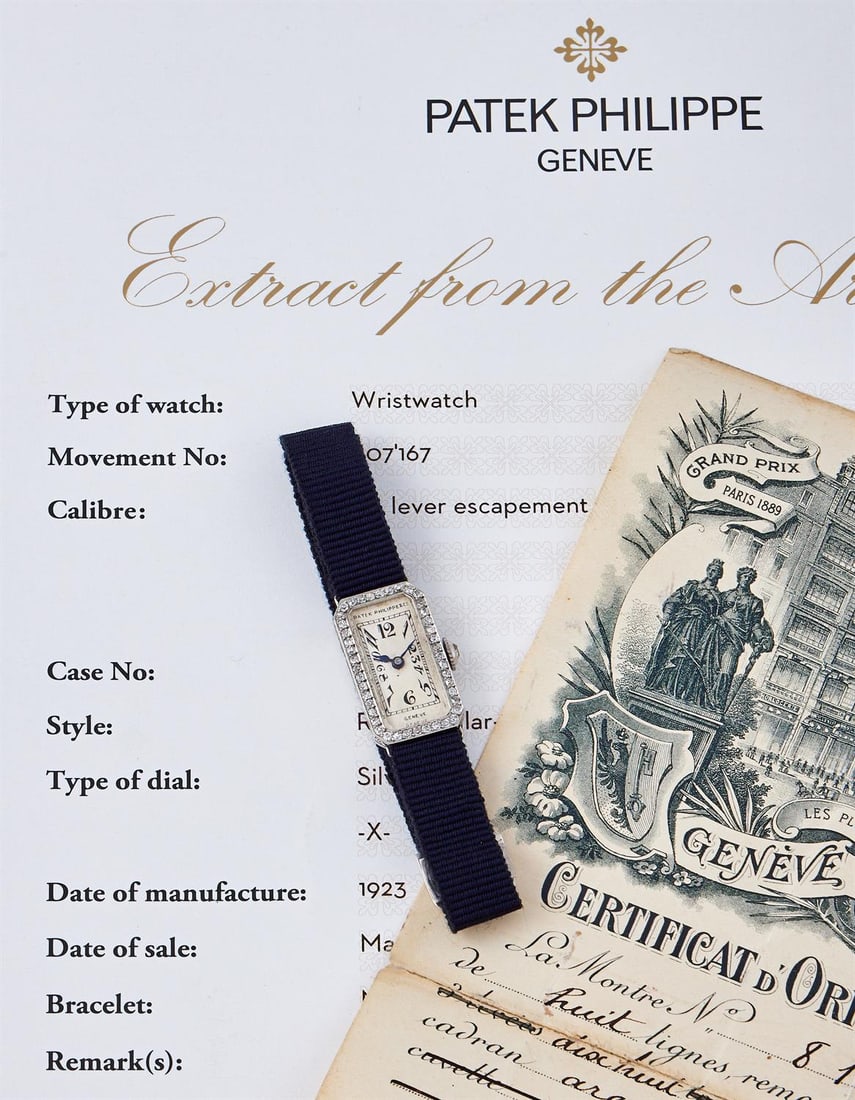 PATEK PHILIPPE, A LADY'S DIAMOND AND PLATINUM COCKTAIL WATCH (1 of 3)