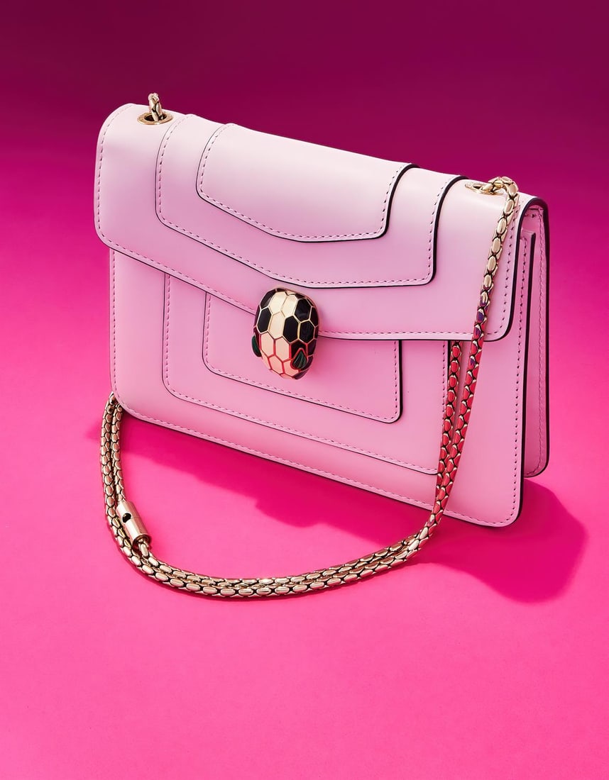 BULGARI, SERPENTI FOREVER, A PINK LEATHER HANDBAG: BULGARI, SERPENTI FOREVERA PINK LEATHER HANDBAG, CIRCA 2021With a detachable chain shoulder strap, magnetic snake head fastener with enamel scales and malachite eyes, opening to a pink satin interior