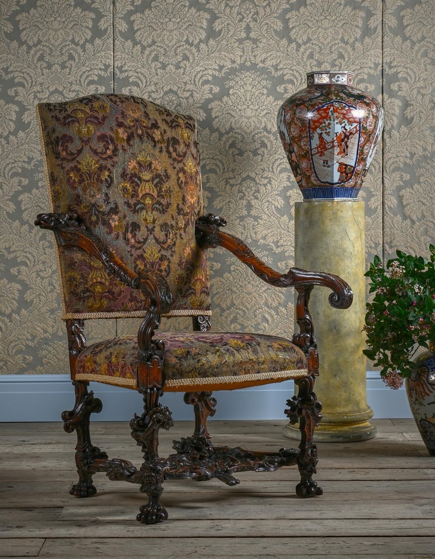 AN ITALIAN CARVED WALNUT AND UPHOLSTERED OPEN ARMCHAIR, 17TH CENTURY (1 of 5)