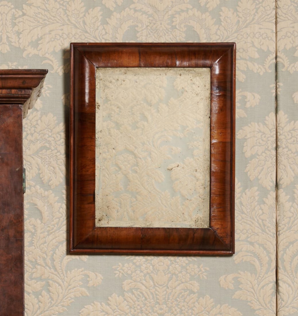 A WILLIAM & MARY WALNUT CUSHION MIRROR, LATE 17TH CENTURY: A WILLIAM & MARY WALNUT CUSHION MIRRORLATE 17TH CENTURY47cm high, 37.5cm wide, 4.5cm deep