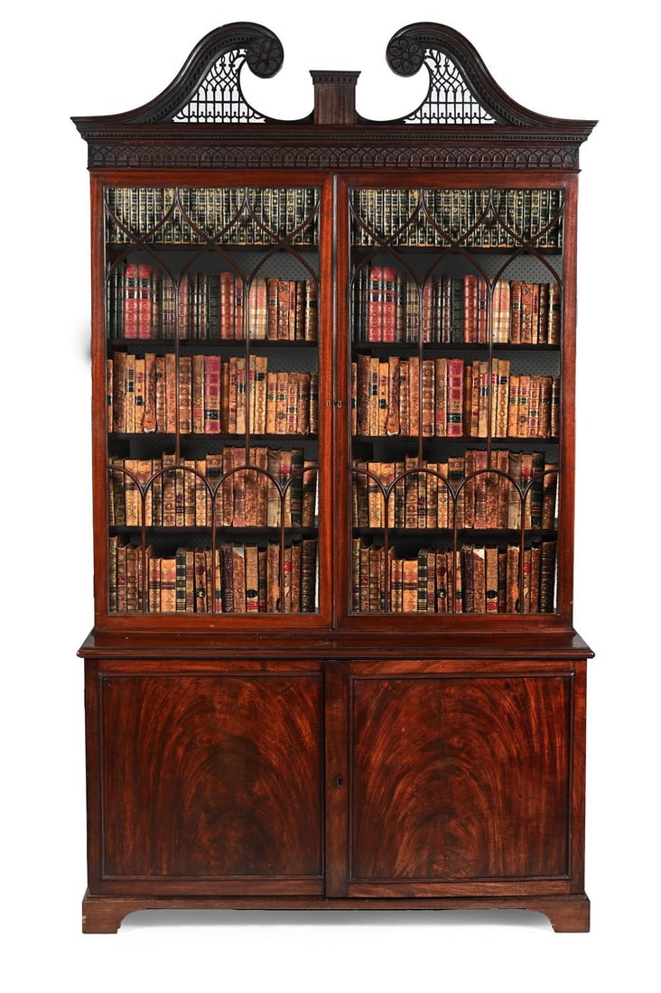 A GEORGE III MAHOGANY LIBRARY BOOKCASE, IN THE MANNER OF THOMAS CHIPPENDALE, CIRCA 1770 (1 of 3)