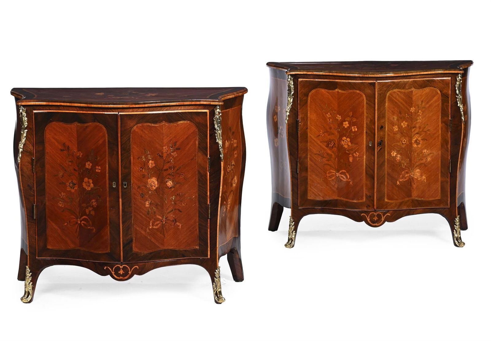 Y A PAIR OF GEORGE III KINGWOOD, ROSEWOOD AND HAREWOOD SERPENTINE COMMODES, CIRCA 1770: Y A PAIR OF GEORGE III KINGWOOD, ROSEWOOD, HAREWOOD AND MARQUETRY SERPENTINE COMMODESATTRIBUTED TO PIERRE LANGLOIS, CIRCA 1765-1770Ormolu mounted and with decorated throughout with panels of