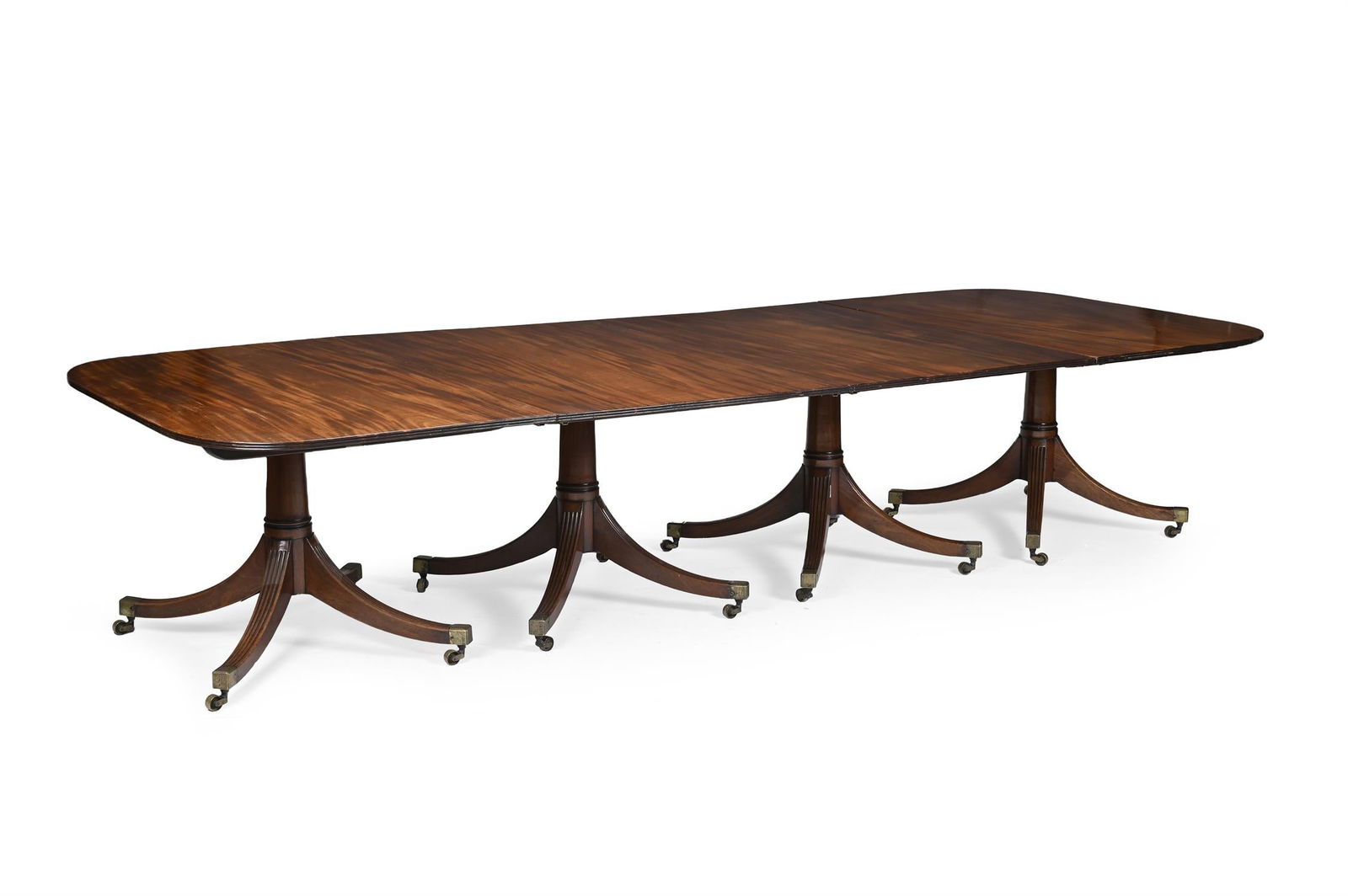 A GEORGE III MAHOGANY FOUR PILLAR EXTENDING DINING TABLE, CIRCA 1790 (1 of 5)