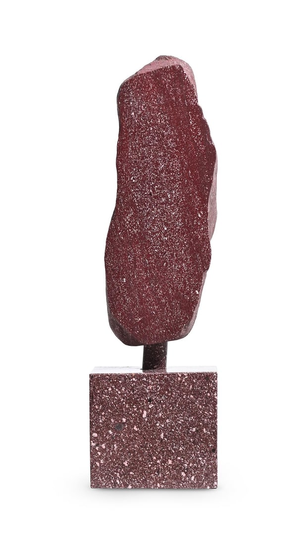 A LARGE EGYPTIAN IMPERIAL PORPHYRY FRAGMENT: A LARGE EGYPTIAN IMPERIAL PORPHYRY FRAGMENT Of part polished form, set on a solid porphyry base with a cylindrical stem 50.5cm high overall, the fragment 35cm high, 14cm wide, 13cm deep, the base 13cm