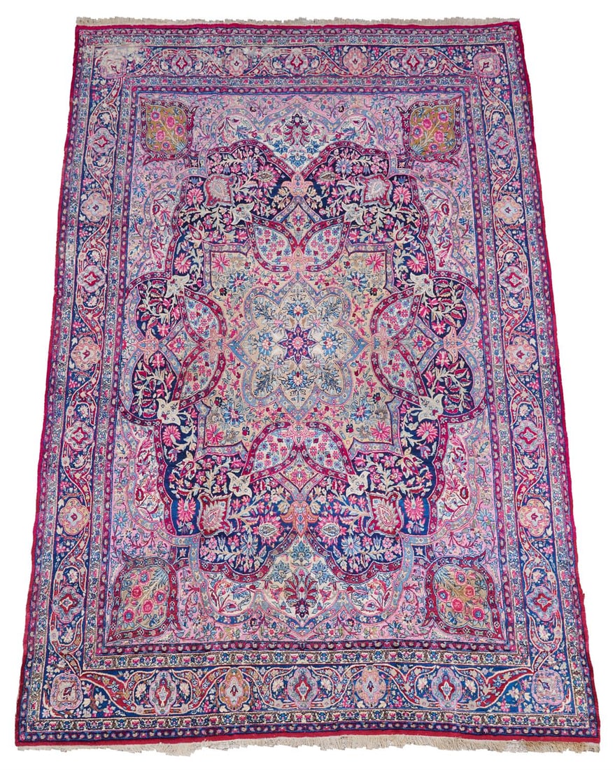 A KIRMAN CARPET: A KIRMAN CARPETapproximately 500 x 351cm