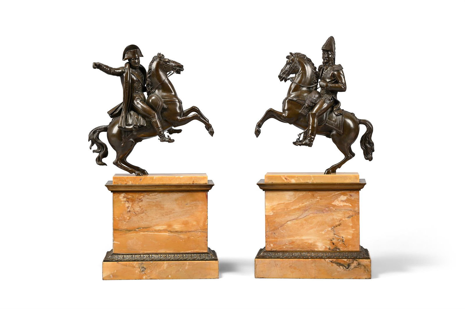 A PAIR OF FRENCH BRONZE EQUESTRIAN FIGURES OF NAPOLEON AND WELLINGTON, 19TH CENTURY: A PAIR OF FRENCH BRONZE EQUESTRIAN FIGURES OF NAPOLEON AND WELLINGTON 19TH CENTURY Set on gilt bronze mounted Siena marble bases the taller example 47cm high, the bases 23 x 12.5cm