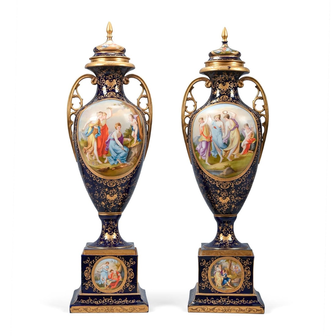 A LARGE PAIR OF BLUE GROUND AND GILT URNS, COVERS AND PLINTH BASES, IN THE VIENNA STYLE, CIRCA 1900 (1 of 10)