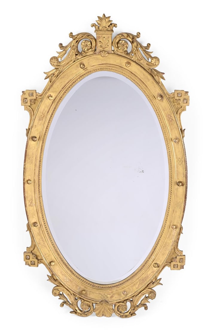 A LARGE CARVED GILTWOOD AND GESSO OVAL MIRROR, IN FRENCH EMPIRE STYLE, 19TH CENTURY: A LARGE CARVED GILTWOOD AND GESSO OVAL MIRROR IN FRENCH EMPIRE STYLE, 19TH CENTURY 172cm high, 92cm wide